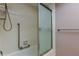 Bathroom featuring a shower and bathtub combination with a sliding glass door at 2380 Shelly Dr # B, Palm Harbor, FL 34684
