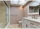 Bathroom with a shower, toilet, vanity and modern fixtures offers optimal living at 2380 Shelly Dr # B, Palm Harbor, FL 34684