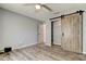 Bedroom with custom closet and laminated floors offers spacious and modern living at 2380 Shelly Dr # B, Palm Harbor, FL 34684