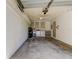 Spacious garage with laundry area, overhead storage, and ample space for parking and projects at 2380 Shelly Dr # B, Palm Harbor, FL 34684