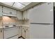 Kitchen showcasing white appliances, bright lighting, and a clean, functional design at 2380 Shelly Dr # B, Palm Harbor, FL 34684