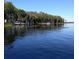 Calm lake view with boat docks and lush greenery along the shoreline on a clear day at 2380 Shelly Dr # B, Palm Harbor, FL 34684
