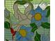 A vibrant stained glass window featuring a bird and flower design catches light and adds unique charm at 2380 Shelly Dr # B, Palm Harbor, FL 34684