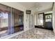 Enclosed sunroom with tile flooring, fan, and glass sliding doors that allows plenty of natural light at 2380 Shelly Dr # B, Palm Harbor, FL 34684