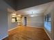 Open-concept living room and dining area with breakfast bar and hardwood floors at 2406 Cypress Pond Rd # 2406, Palm Harbor, FL 34683