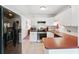 Functional kitchen with stainless steel refrigerator and white cabinets and countertops at 2461 Rhodesian Dr # 37, Clearwater, FL 33763