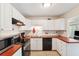 Functional kitchen with white cabinetry, stainless steel appliances, and complementary countertops at 2461 Rhodesian Dr # 37, Clearwater, FL 33763