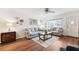 Bright living room featuring wood floors, neutral paint, and comfortable seating area with a coffee table at 2461 Rhodesian Dr # 37, Clearwater, FL 33763