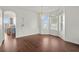 Dining space with natural light, chandelier, and hard wood floors at 2832 Brinley Dr, Trinity, FL 34655
