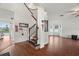 Entryway with wood floors, staircase, and views into adjacent living spaces at 2832 Brinley Dr, Trinity, FL 34655