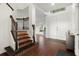 Inviting foyer with wood flooring, staircase, and natural light at 2832 Brinley Dr, Trinity, FL 34655