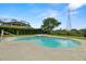 Clean, kidney-shaped pool and spa provide a refreshing backyard oasis, perfect for relaxation and entertaining at 2832 Brinley Dr, Trinity, FL 34655