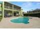 Inviting pool and spa with spacious patio, complemented by a well-maintained green exterior, perfect for relaxation at 2832 Brinley Dr, Trinity, FL 34655
