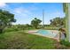 Relaxing pool and spa combination with lush greenery create a serene backyard oasis for leisure and enjoyment at 2832 Brinley Dr, Trinity, FL 34655