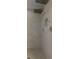 Modern shower featuring dual shower heads, tiled walls, and a convenient built-in niche with chrome hardware at 2832 Brinley Dr, Trinity, FL 34655