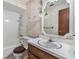 Bathroom featuring a vanity, toilet, shower, and large mirror providing good light and reflection at 309 Kenmore Rd, Brandon, FL 33511