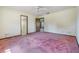 The bedroom has an overhead fan, carpeted floor, and natural light coming from outside at 309 Kenmore Rd, Brandon, FL 33511