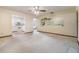 Bright living room featuring carpet and view of the kitchen at 309 Kenmore Rd, Brandon, FL 33511