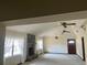 Spacious living room with a stone fireplace and large windows offering plenty of natural light at 309 Kenmore Rd, Brandon, FL 33511