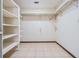 A spacious walk-in closet with adjustable shelving and tile floors at 309 Kenmore Rd, Brandon, FL 33511