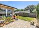 Charming backyard with a brick patio and lush landscaping at 3105 Avocet Pl, Safety Harbor, FL 34695