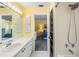 Well-lit bathroom connected to the primary bedroom featuring a combined tub and shower at 3105 Avocet Pl, Safety Harbor, FL 34695