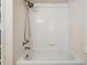 Bathroom featuring a standard tub/shower with a white tiled surround at 3105 Avocet Pl, Safety Harbor, FL 34695