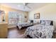 Bright bedroom with two twin beds, ceiling fan and large window with lots of natural light at 3105 Avocet Pl, Safety Harbor, FL 34695