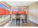 Bright dining area with large windows, modern lighting, and a cozy atmosphere at 3105 Avocet Pl, Safety Harbor, FL 34695