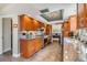 Modern kitchen with stainless steel appliances, granite countertops, and ample cabinet space at 3105 Avocet Pl, Safety Harbor, FL 34695