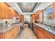 Updated kitchen with granite counters, stainless appliances, and ample storage space at 3105 Avocet Pl, Safety Harbor, FL 34695