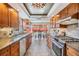 Updated kitchen boasts granite countertops, stainless appliances, and opens to the dining area at 3105 Avocet Pl, Safety Harbor, FL 34695
