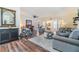 Inviting living room featuring hardwood floors, comfortable seating, and ample natural light at 3105 Avocet Pl, Safety Harbor, FL 34695