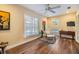 Inviting living room with a lounge chair, bright window, and a door to a pool area at 3105 Avocet Pl, Safety Harbor, FL 34695
