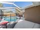 Screened-in pool with clean, refreshing water and secure safety fence at 3105 Avocet Pl, Safety Harbor, FL 34695