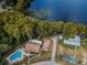 Aerial view showcasing the community's pool, clubhouse, lake access, and recreational amenities at 3126 Highlands Blvd # 3126, Palm Harbor, FL 34684
