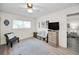 Bedroom featuring hardwood floors, a ceiling fan, and a window at 3126 Highlands Blvd # 3126, Palm Harbor, FL 34684
