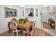 Cozy dining area with a view into the kitchen, complemented by a stylish table setting at 3126 Highlands Blvd # 3126, Palm Harbor, FL 34684