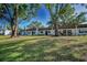 Charming townhomes surrounded by mature trees and a well-maintained lawn offering curb appeal at 3126 Highlands Blvd # 3126, Palm Harbor, FL 34684