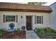 Inviting condo featuring a cozy front patio with manicured landscaping and charming curb appeal at 3126 Highlands Blvd # 3126, Palm Harbor, FL 34684