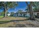 Charming townhomes surrounded by mature trees and a well-maintained lawn offering curb appeal at 3126 Highlands Blvd # 3126, Palm Harbor, FL 34684