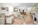 Bright living room boasts stylish furnishings and decor with wood-look floors and lots of natural light at 3126 Highlands Blvd # 3126, Palm Harbor, FL 34684