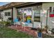 A cozy brick patio offers an outdoor seating area with a grill at 3126 Highlands Blvd # 3126, Palm Harbor, FL 34684
