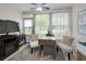 Bright sunroom with tile flooring, a ceiling fan, and a view of the backyard at 3126 Highlands Blvd # 3126, Palm Harbor, FL 34684