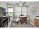 Bright sunroom with tile flooring, a ceiling fan, and a view of the backyard at 3126 Highlands Blvd # 3126, Palm Harbor, FL 34684