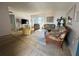 Comfortable living room features wicker furniture and a sliding door to the balcony at 320 Medallion Blvd # G, Madeira Beach, FL 33708