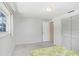 Bright bedroom with window views, carpeted floor, and closet at 3247 Kimberly Oaks Dr, Holiday, FL 34691