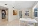 Bright dining area with view to kitchen and exterior at 3247 Kimberly Oaks Dr, Holiday, FL 34691