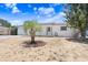 Charming single-story home featuring a one car garage, well-maintained landscaping, and a mature tree at 3247 Kimberly Oaks Dr, Holiday, FL 34691