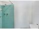 Shower featuring teal tile and silver fixtures at 3247 Kimberly Oaks Dr, Holiday, FL 34691